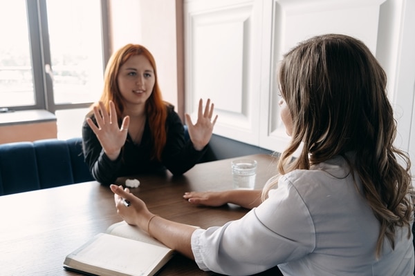 Woman life coach working with woman client